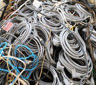 A large pile of tangled cables and wires in various colors.
