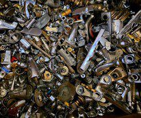 A dense pile of assorted metal parts and mechanical components.